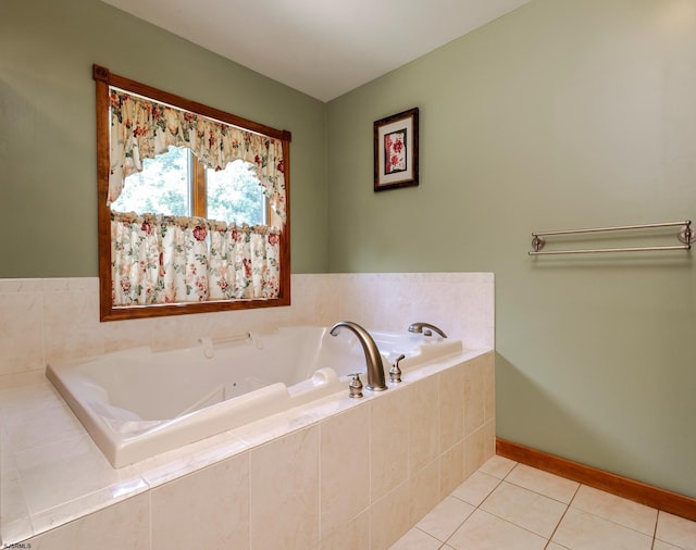 bathroom featuring tile patterned floors, baseboards, and a garden tub