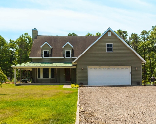 view of front of property with covered porch, gravel driveway, a front yard, metal roof, and a chimney