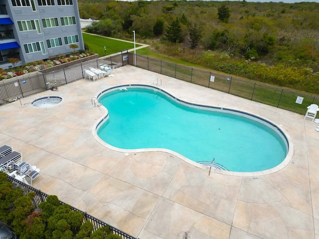 view of swimming pool with a patio area