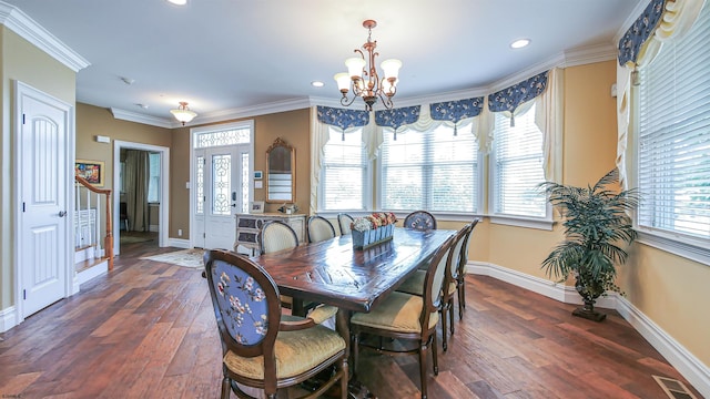 dining space with a notable chandelier, dark hardwood / wood-style flooring, and ornamental molding