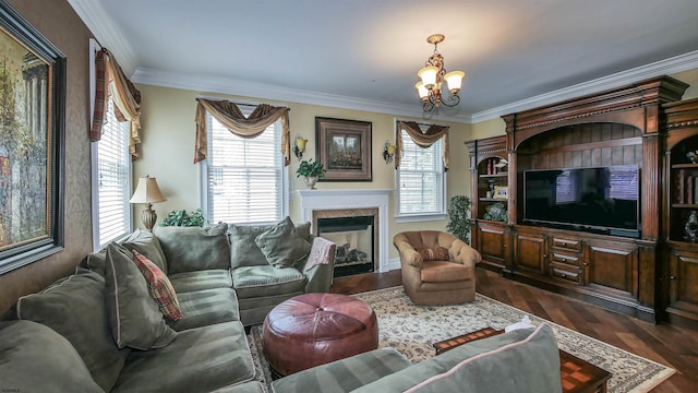 living room featuring dark wood-type flooring, ornamental molding, a wealth of natural light, and an inviting chandelier