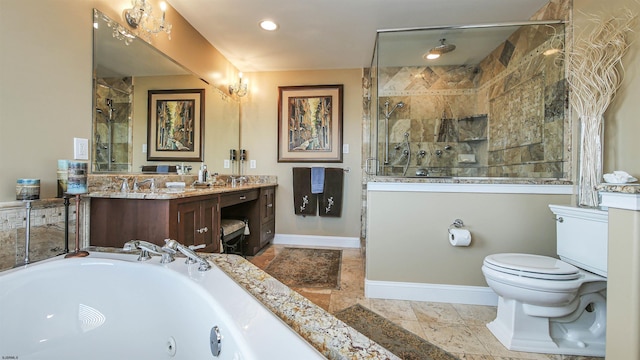 bathroom with toilet, a tile shower, vanity, and tile patterned flooring