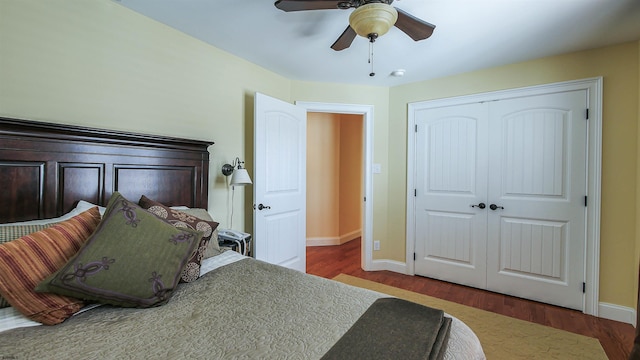 bedroom with ceiling fan, hardwood / wood-style flooring, and a closet