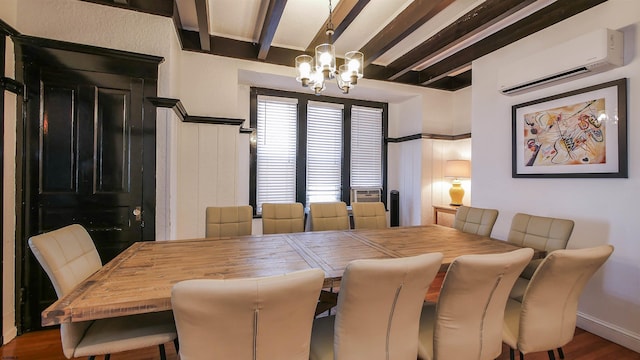 dining area featuring beam ceiling, a wall mounted air conditioner, an inviting chandelier, and wood finished floors