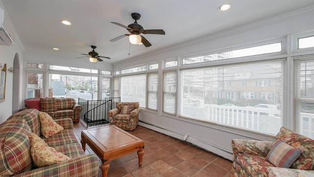 sunroom with ceiling fan, a baseboard radiator, and a wall mounted AC