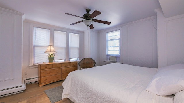 bedroom with a baseboard heating unit, baseboard heating, light wood-style flooring, cooling unit, and a ceiling fan