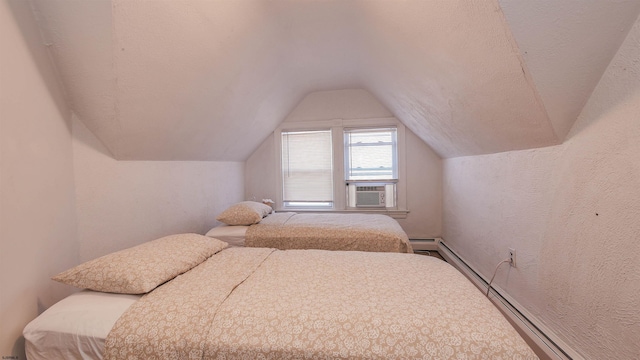 bedroom featuring a textured wall, a textured ceiling, baseboard heating, and vaulted ceiling