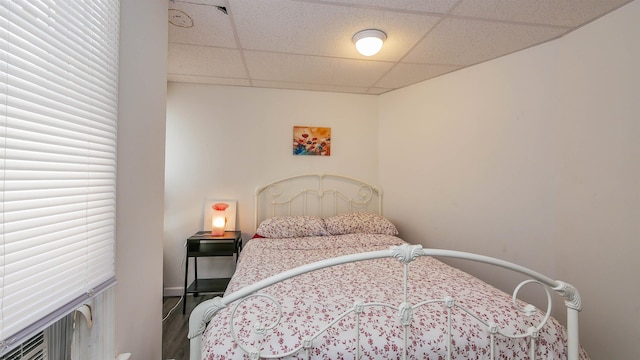 bedroom with a paneled ceiling