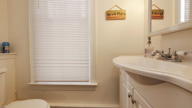 bathroom featuring vanity and toilet