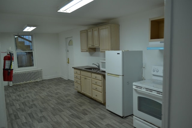 kitchen with radiator, white appliances, sink, light hardwood / wood-style floors, and range hood