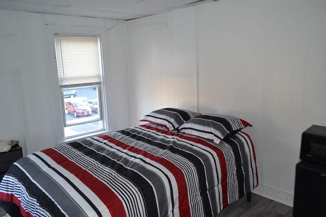 bedroom featuring dark hardwood / wood-style flooring