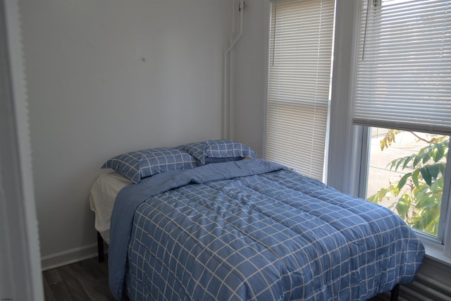 bedroom featuring dark wood-type flooring