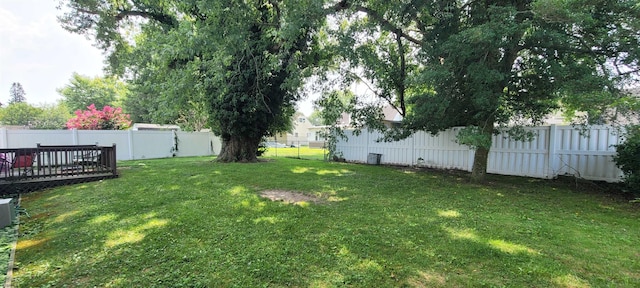 view of yard featuring a wooden deck