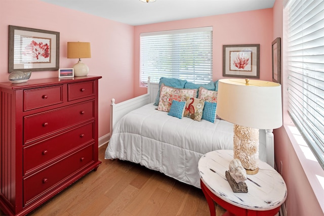 bedroom with wood finished floors