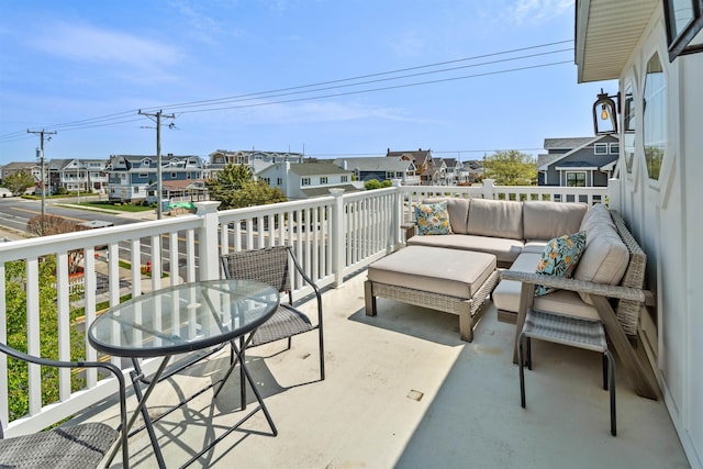 balcony with a residential view and an outdoor living space