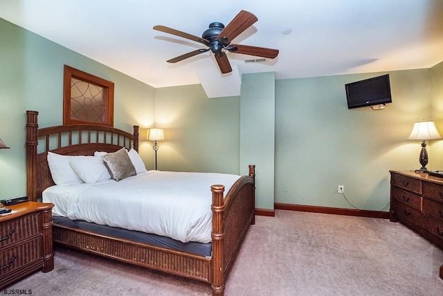 bedroom with ceiling fan, carpet flooring, and baseboards