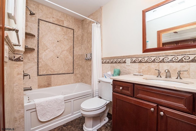 full bathroom with toilet, tile patterned flooring, shower / bath combination with curtain, vanity, and tile walls