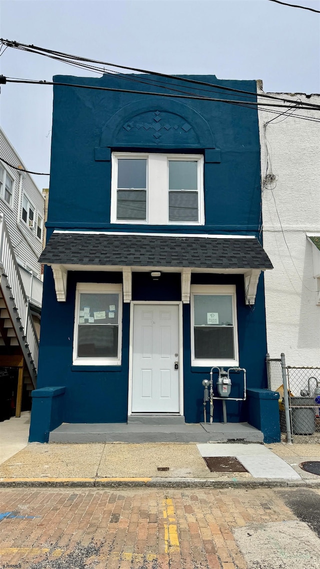 1 S Metropolitan Ave, Atlantic City, NJ 08401 - view of front of home with roof with shingles and fence