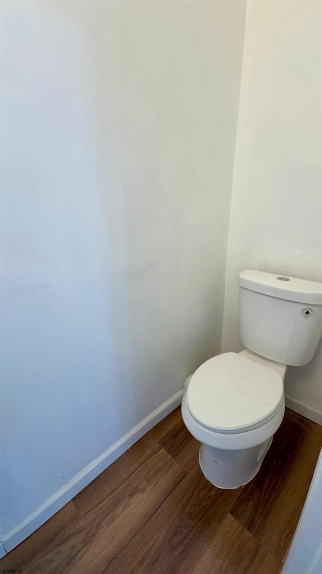 1 S Metropolitan Ave, Atlantic City, NJ 08401 - bathroom featuring toilet, wood finished floors, and baseboards