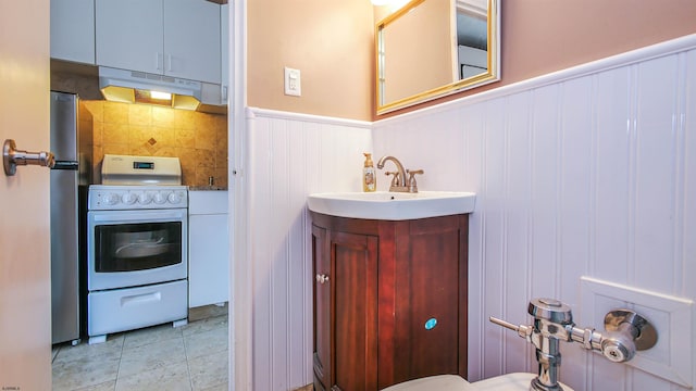 bathroom featuring tile patterned flooring and vanity