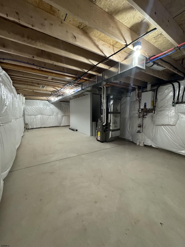 unfinished basement with heating unit