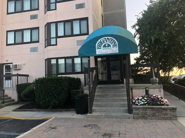 outdoor building at dusk with a wall mounted AC