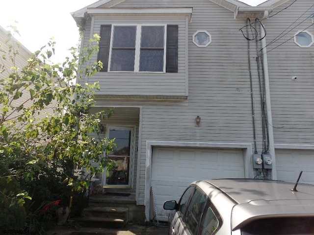 view of side of home featuring a garage