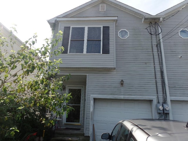 view of property exterior with a garage