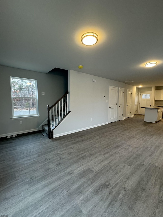 unfurnished living room featuring hardwood / wood-style floors