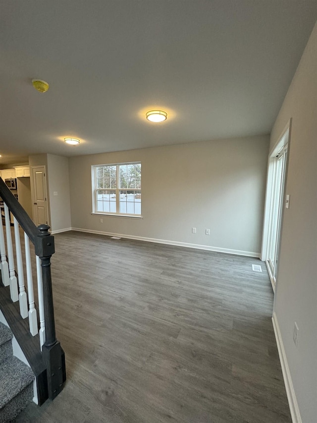 interior space with dark hardwood / wood-style flooring