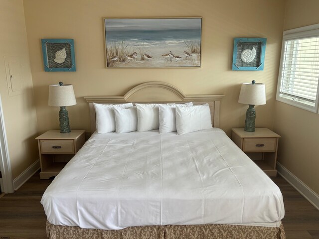 bedroom featuring dark hardwood / wood-style flooring