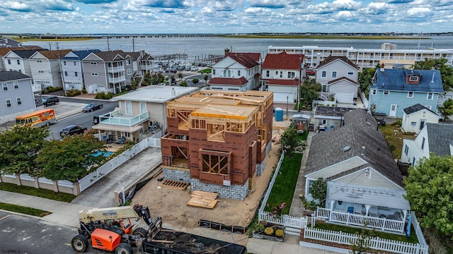 bird's eye view with a residential view and a water view