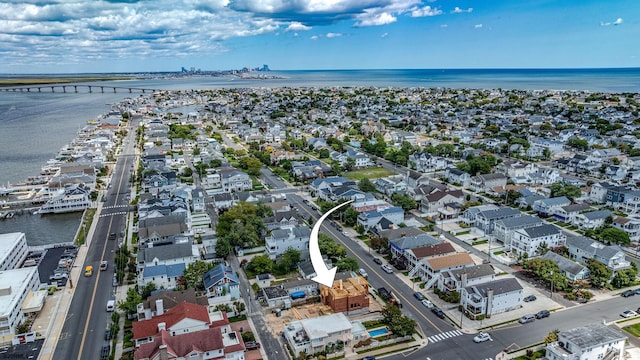 bird's eye view featuring a water view and a residential view