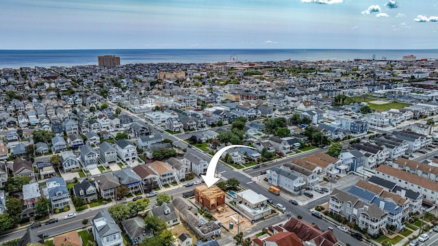 aerial view featuring a water view and a residential view