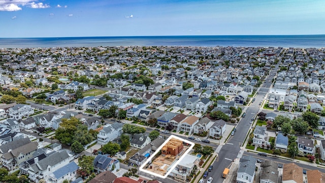 bird's eye view featuring a residential view and a water view