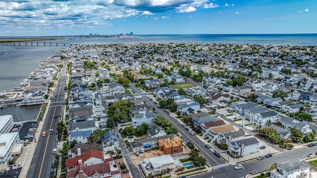 bird's eye view with a water view and a residential view