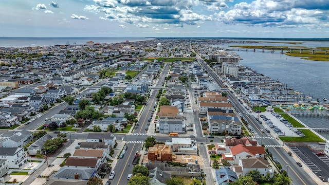 birds eye view of property featuring a water view and a city view