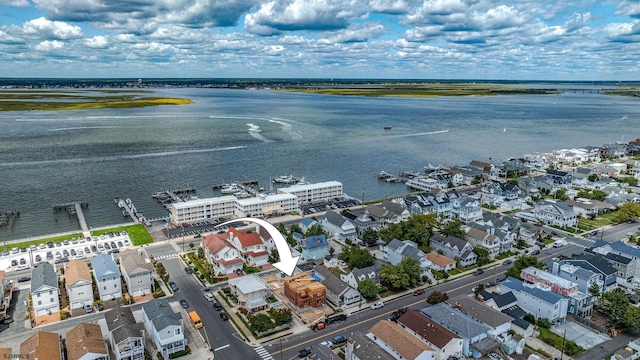 aerial view with a water view and a residential view