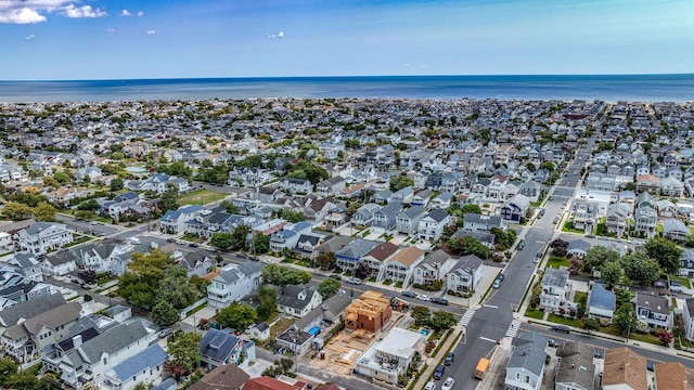 birds eye view of property with a water view and a residential view