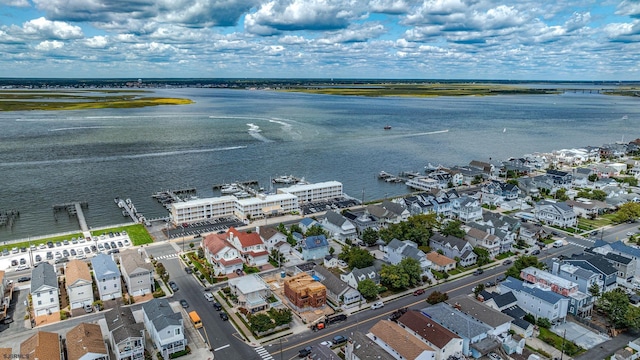 bird's eye view with a water view and a residential view