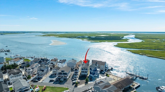 aerial view with a water view and a residential view