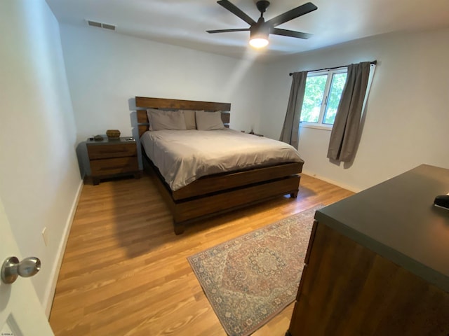 bedroom featuring ceiling fan and light hardwood / wood-style flooring