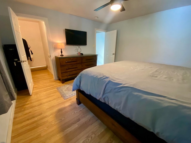 bedroom featuring light hardwood / wood-style floors and ceiling fan