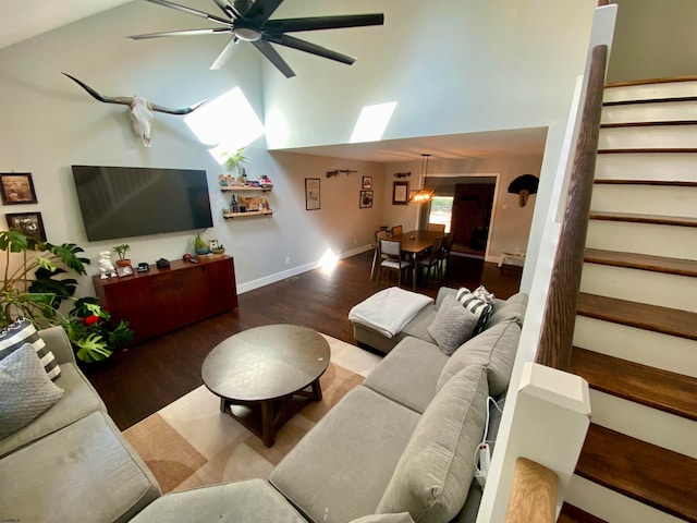 living room with high vaulted ceiling, ceiling fan, and hardwood / wood-style flooring