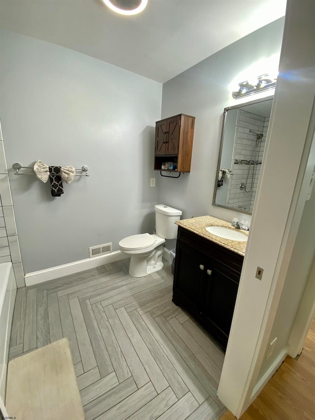 full bathroom featuring parquet floors, toilet, independent shower and bath, and vanity