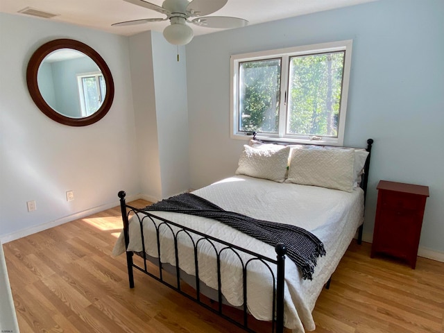 bedroom featuring ceiling fan and light hardwood / wood-style floors