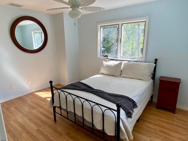 bedroom featuring ceiling fan and light wood-type flooring