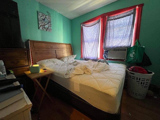 bedroom with hardwood / wood-style floors