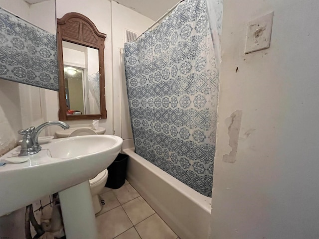 bathroom featuring shower / bath combo and tile patterned floors