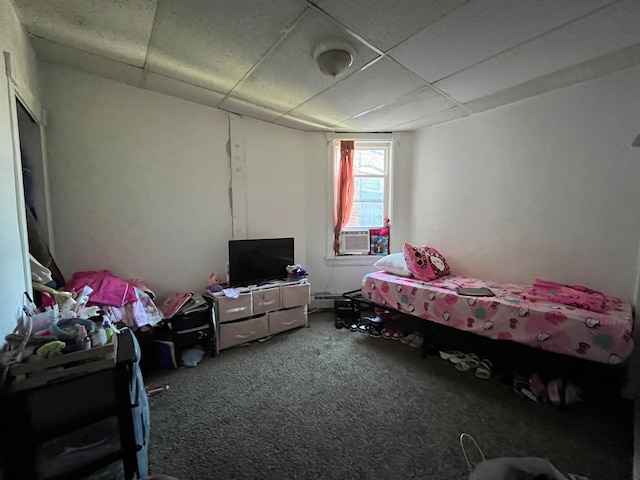 bedroom with cooling unit, carpet, and a drop ceiling